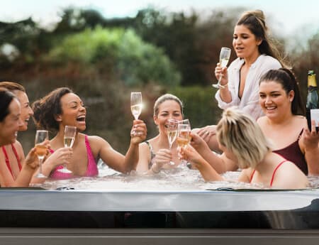 Friends relaxing together in an Earth Spa during golden hour